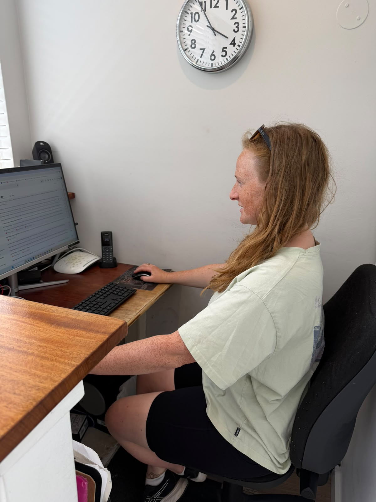 Woman sitting at a desk with good posture